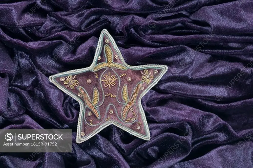 Star shape with embroidery on velvet