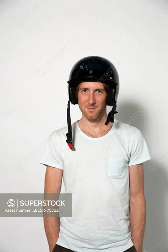 Man wearing safety helmet, smiling, portrait