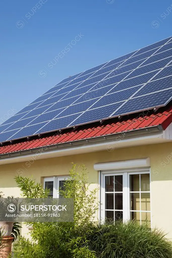 Germany, Cologne, Roof of residential building with solar panels