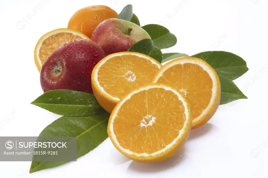 Fresh orange halves and apples