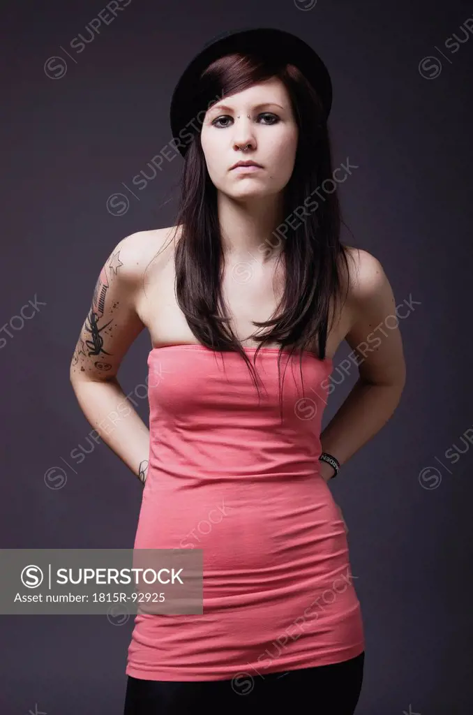 Young woman with tattoos, portrait