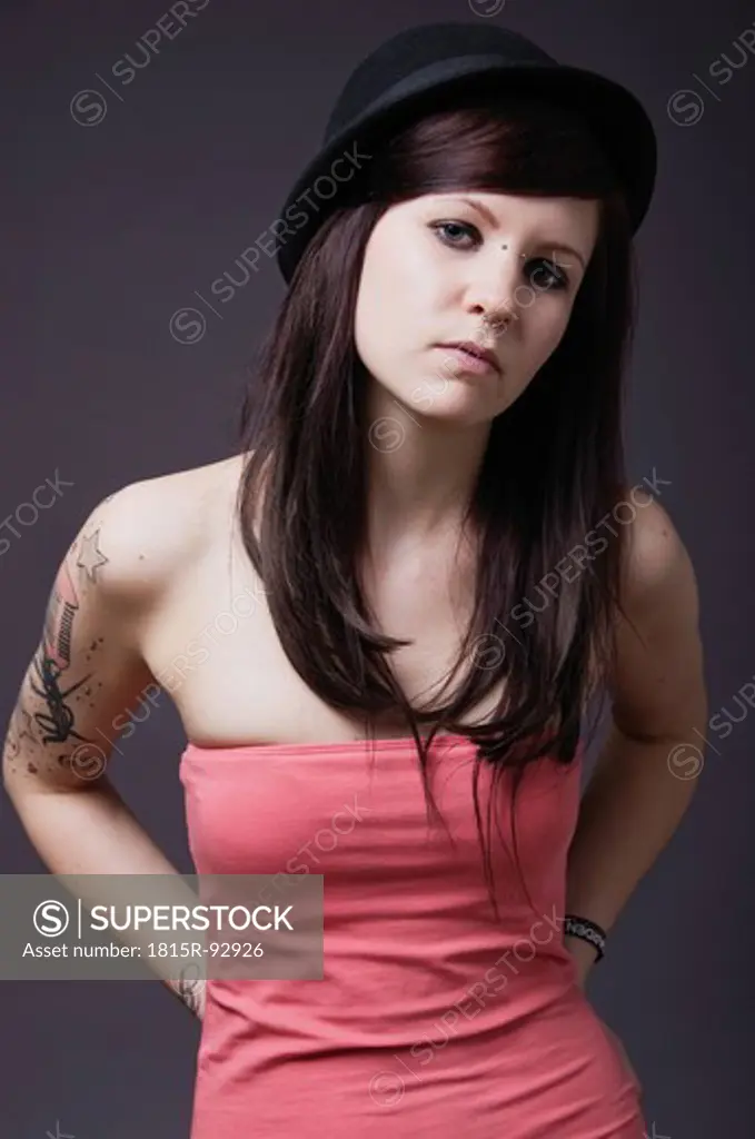 Young woman with tattoos, portrait