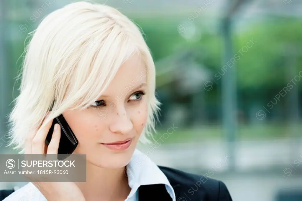 Germany, Bavaria, Munich, Young woman on phone