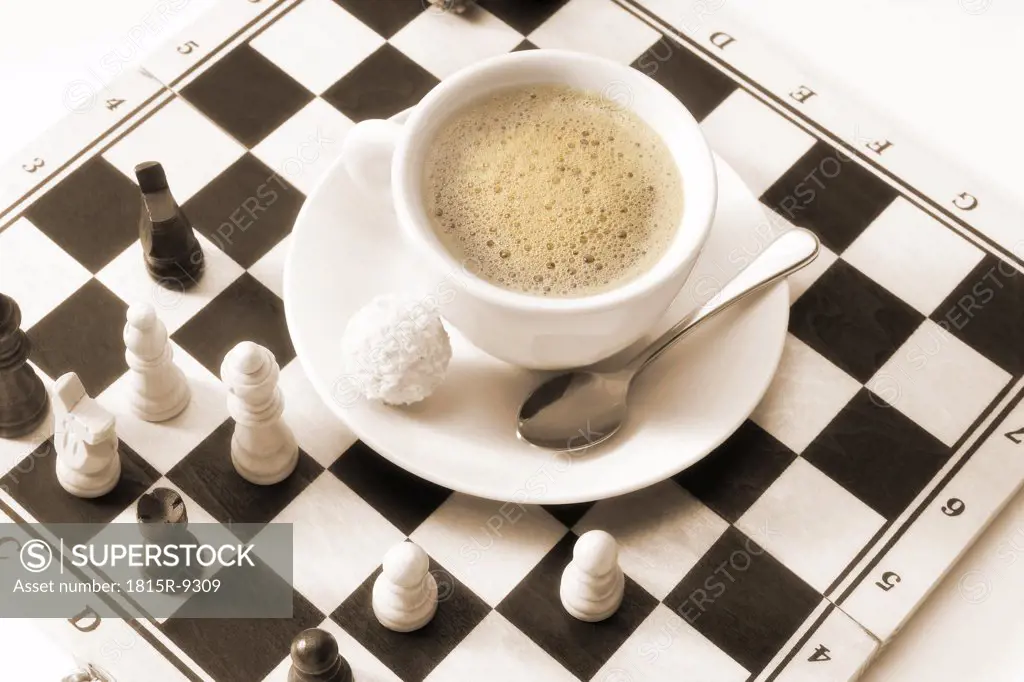 Cup of coffee on chess board