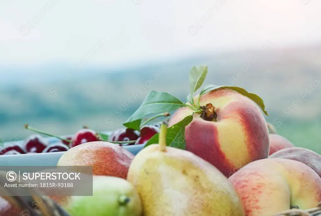 Italy, Tuscany, Magliano, Close up of peach, pears and cherries