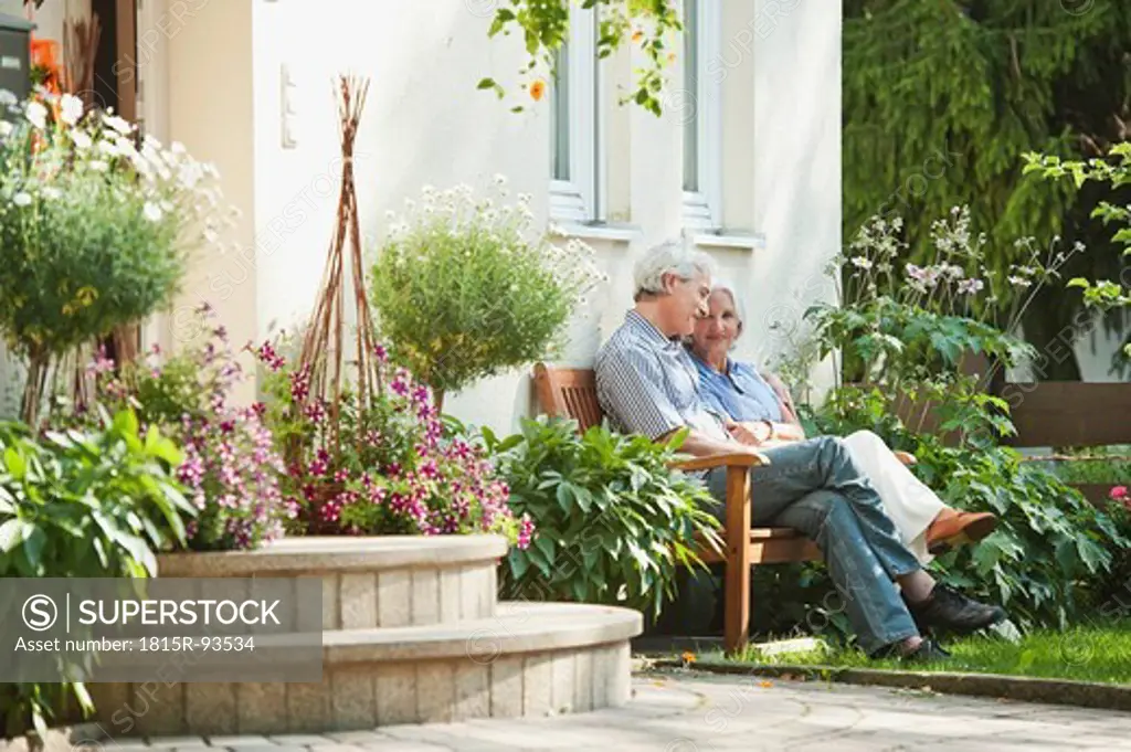 Germany, Bavaria, Man and woman sitting in garden