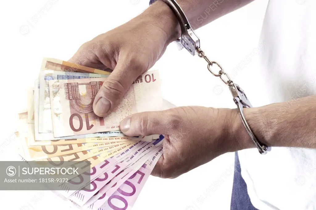 man arrested holding black money