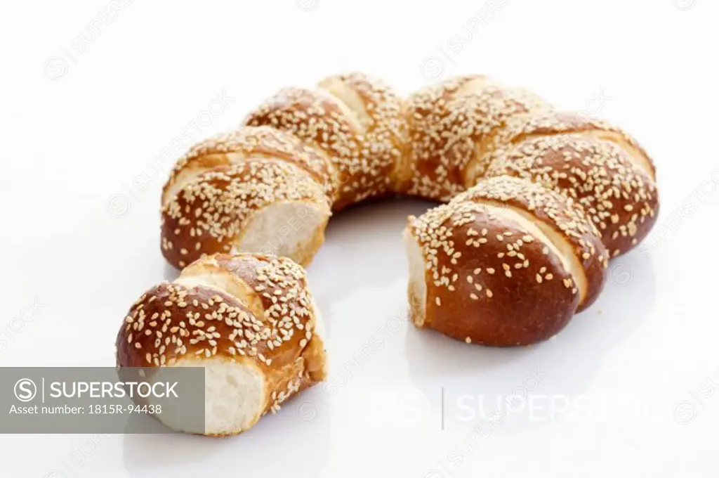 Pretzel wrath with sesame seed on white background, close up