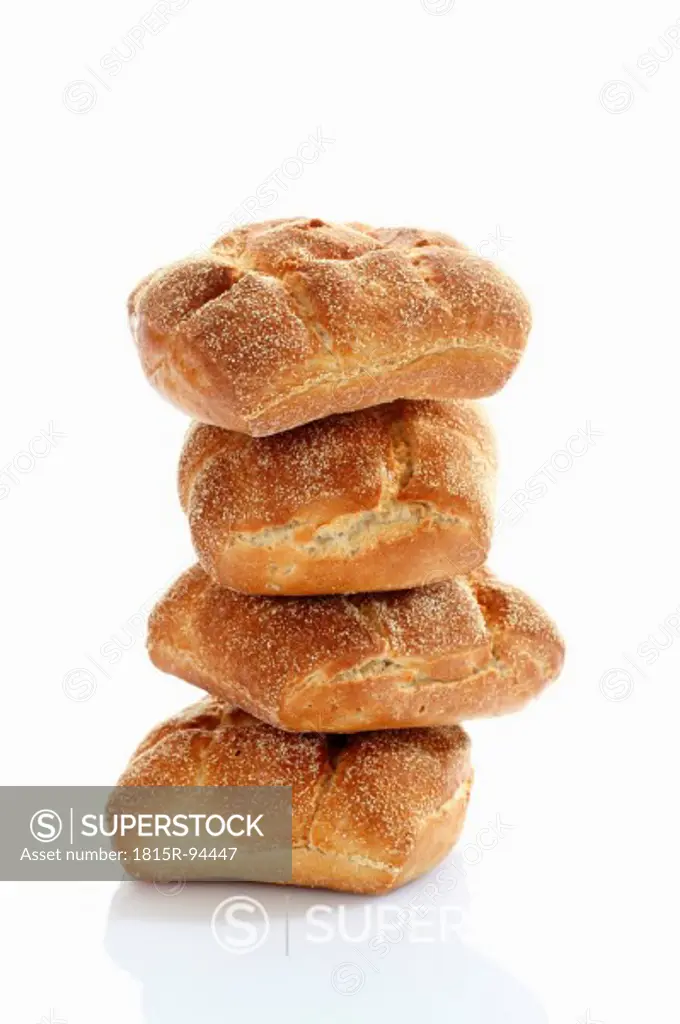 Bread roll of barley and wheat on white background, close up