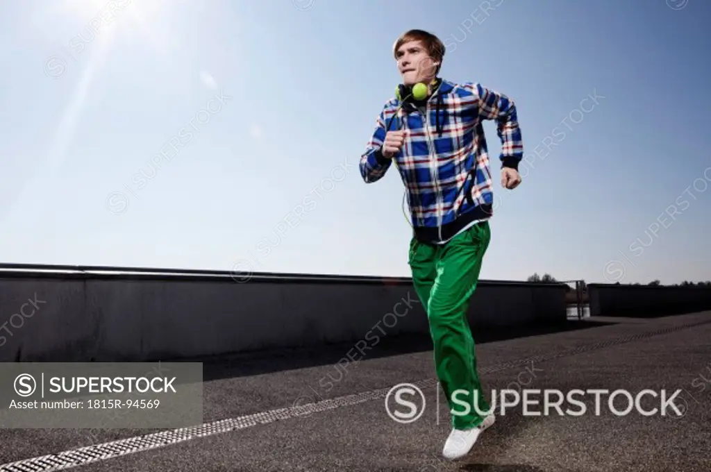 Germany, Bavaria, Munich, Young man jogging
