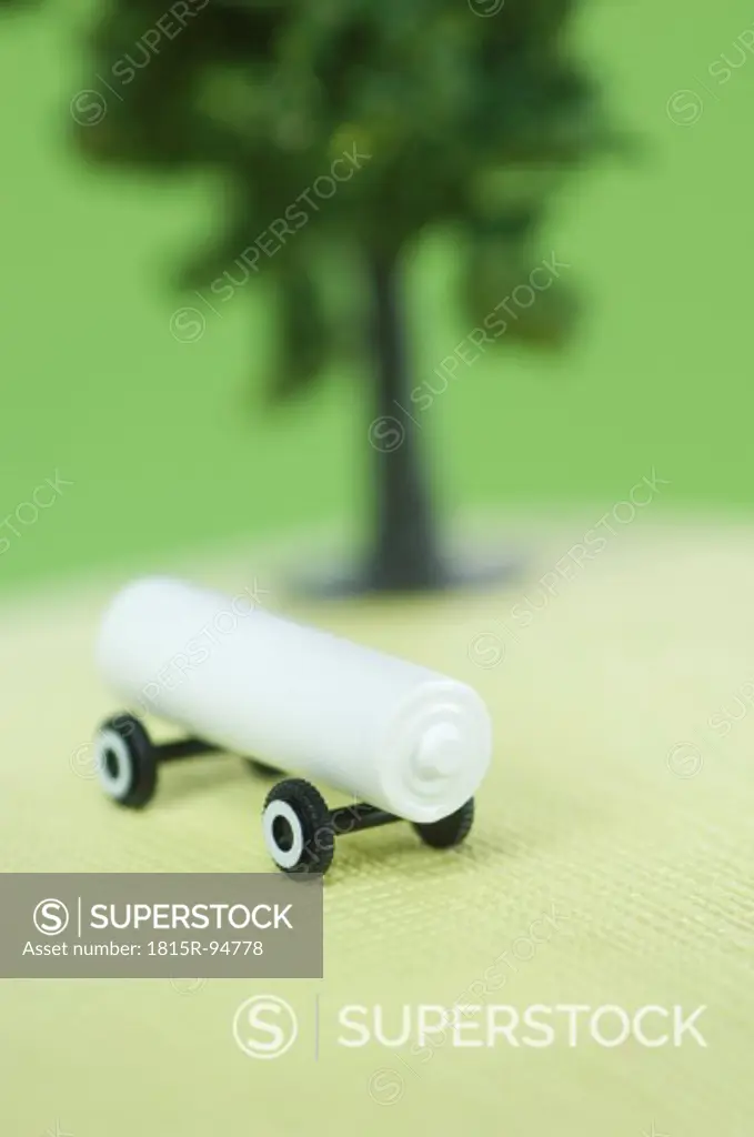 Battery on wheel with tree model, close up