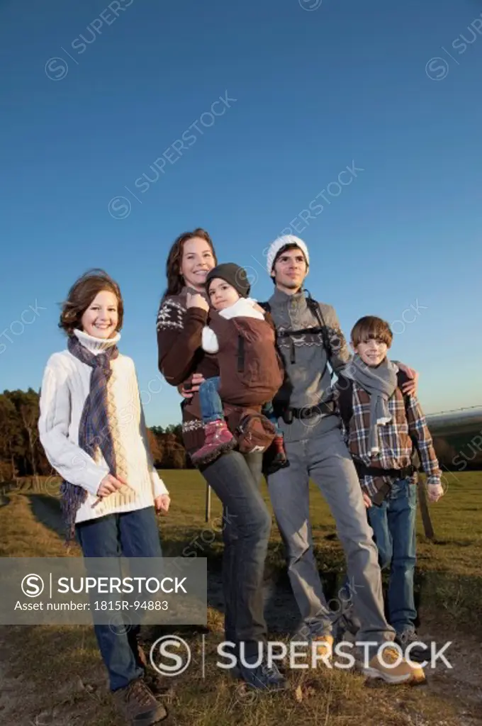 Germany, Bavaria, Family hiking, smiling