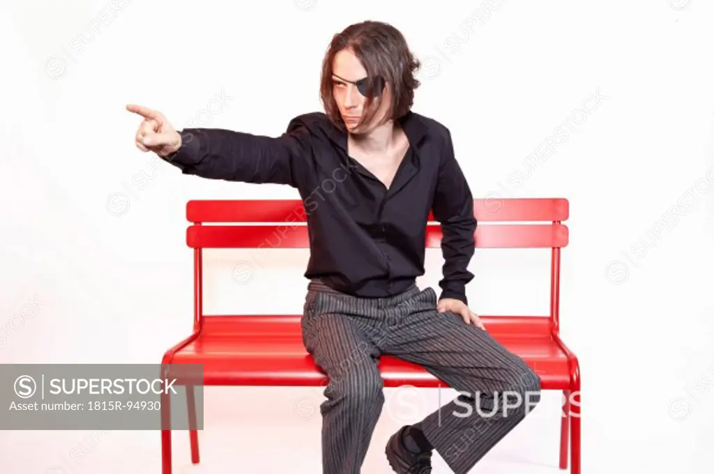 Mid adult man Sitting on bench against white background