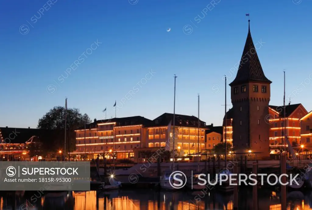 Germany, Bavaria, Swabia, Lindau, View of Mangturm tower with harbour at night