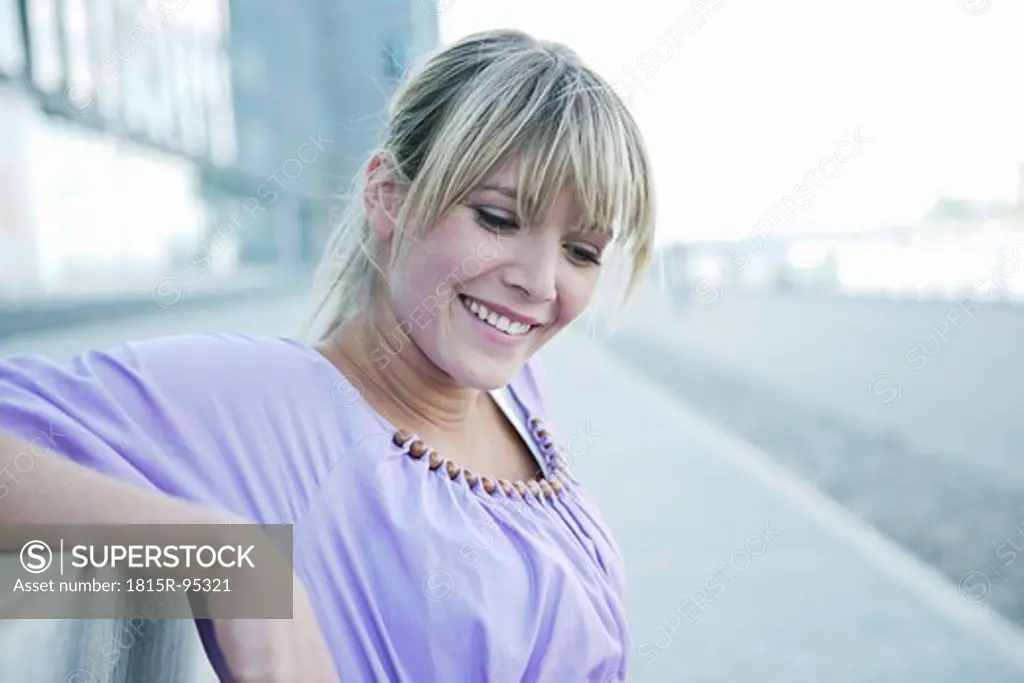 Germany, Cologne, Young woman smiling, close up