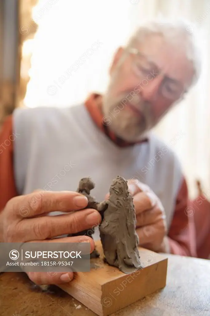 Germany, Upper Bavaria, Craftsperson carving statue