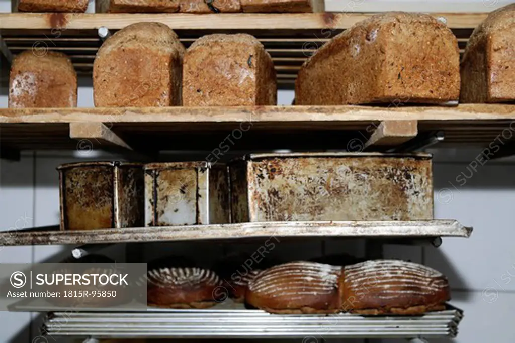 Germany, Upper Bavaria, Egling, Breads on shelf in wood stove bakery