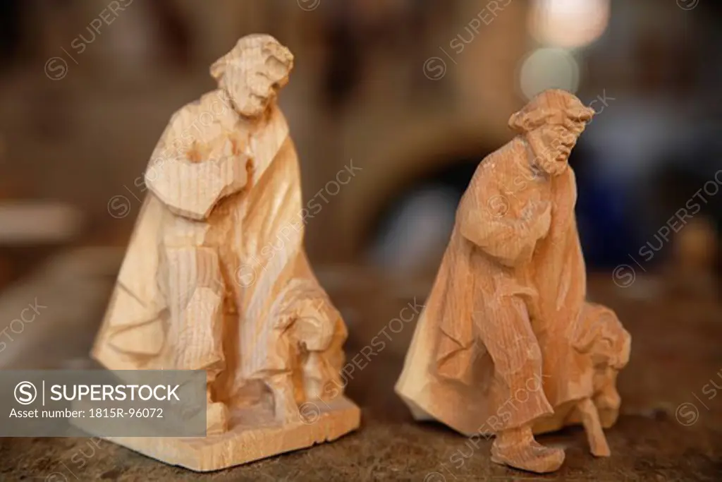 Germany, Upper Bavaria, Statues at wood carver studio, close up