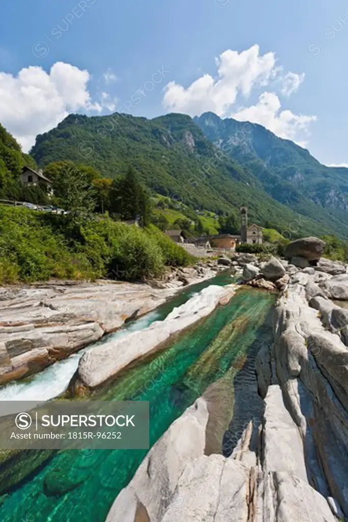 Switzerland, Ticino, View of Verzasca River with mountain in background