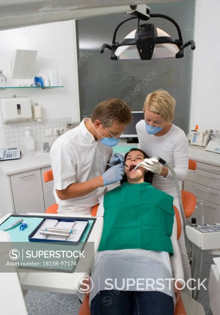 Austria, Dentist and nurse examining patient