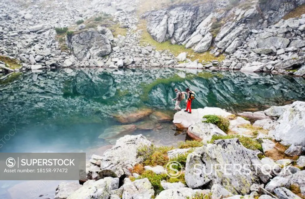 Austria, Styria, Man and woman standing at Lake Obersee