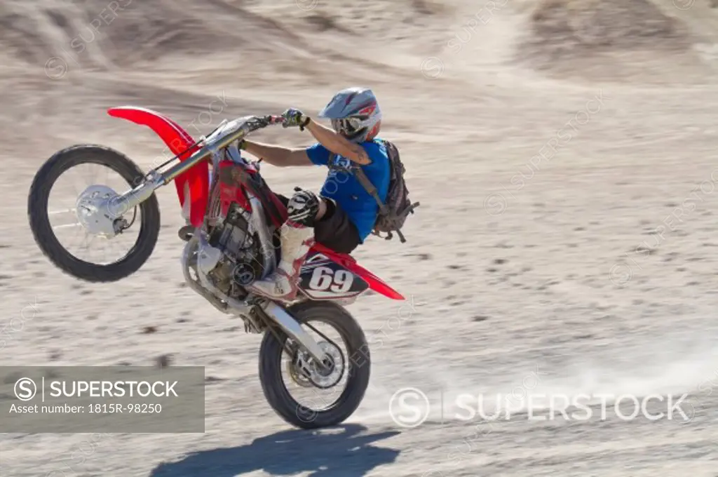 USA, California, Motocrosser performing wheelie on Palm Desert