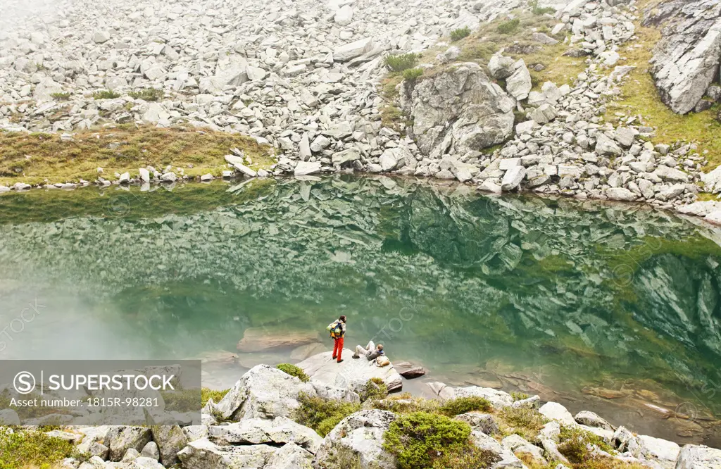 Austria, Styria, Man and woman having rest at Lake Obersee