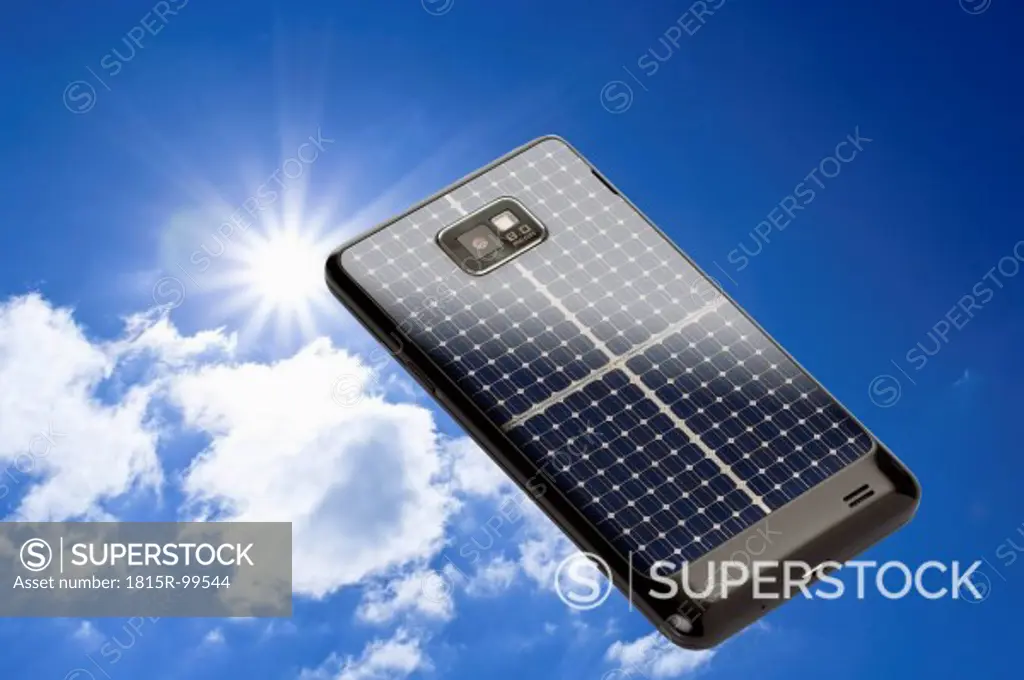 Solar mobile phone against sky