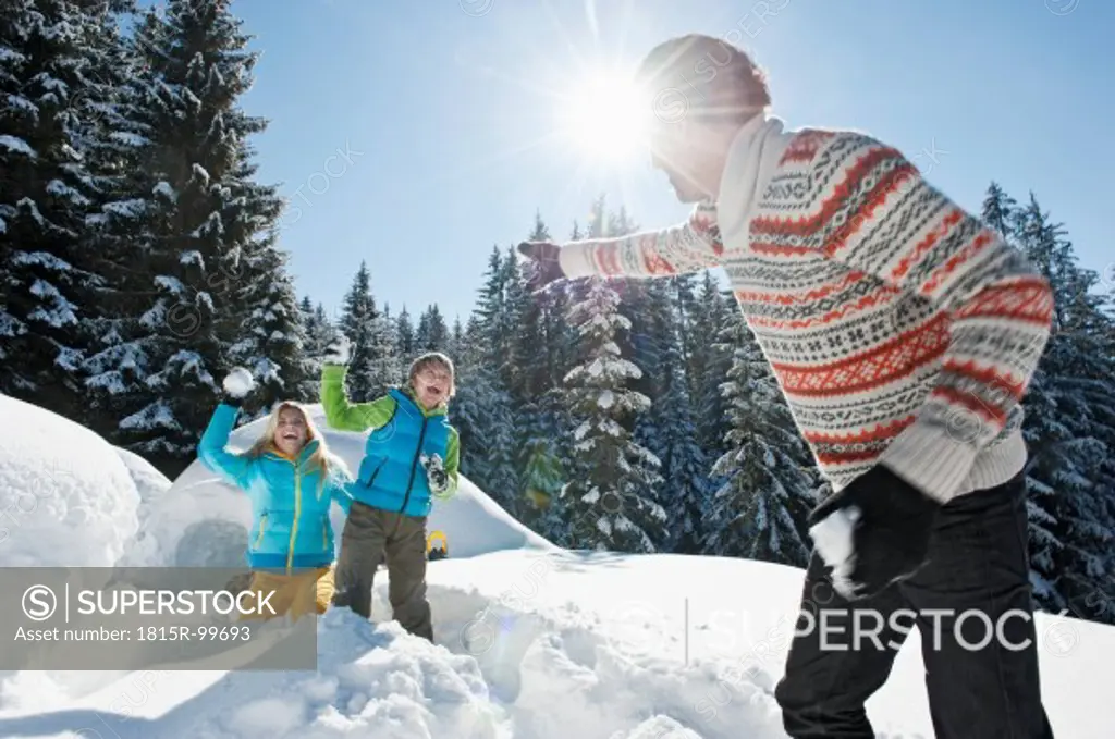 Austria, Salzburg County, Family playing near igloo