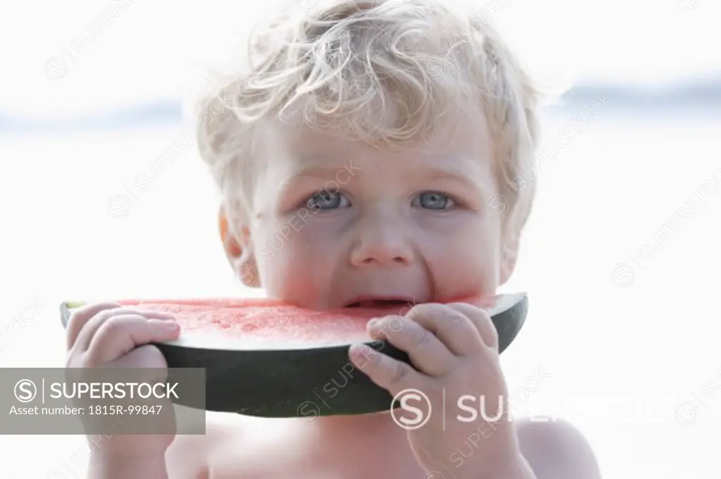 Germany, Bavaria, Boy eating watermelon, close up