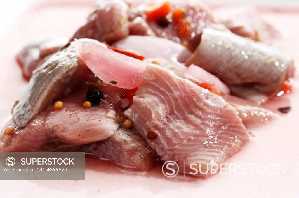 Salted herrings in plate, close up