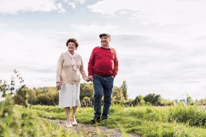 Senior couple on a walk in rural landscape