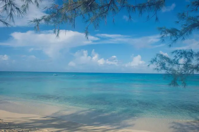 Scenic view of Norman Saunders beach against blue sky at Grand Turk, Turks And Caicos Islands