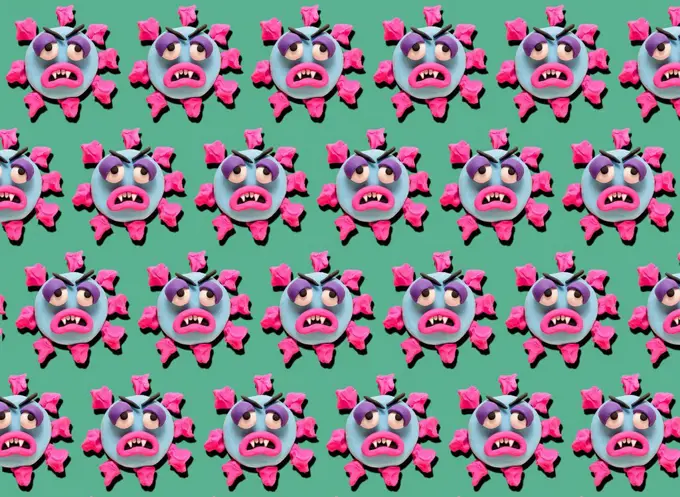 Rows of coronoa viruses with plasticine faces on green background