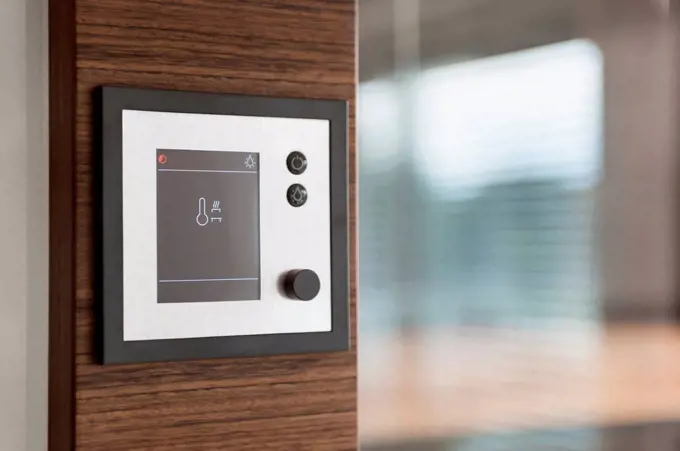 Close-up of digital sauna controlled device on wall at home