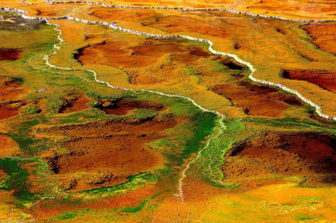 Aerial view of brown acidic landscape surrounding Rio Tinto river, Spain