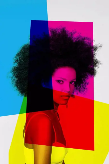 Confident woman with primary colors against white background