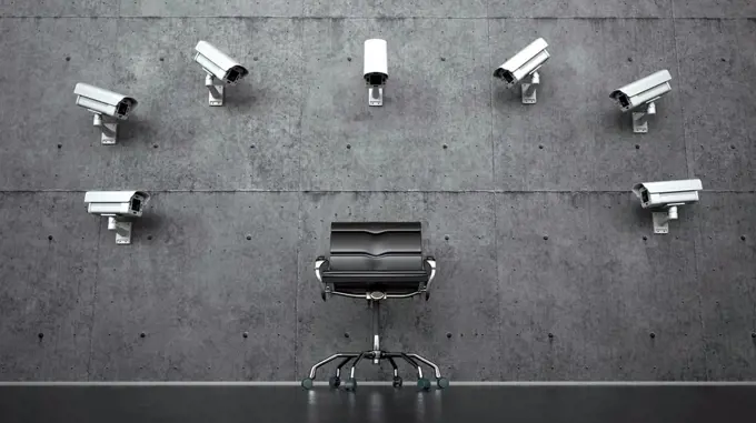 Three dimensional render of security cameras pointed at empty office chair