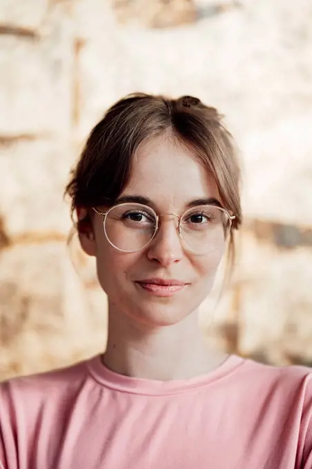 Woman with brown hair wearing eyeglasses