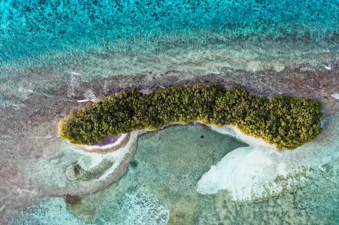 Desert island amidst sea in Lhaviyani Atoll, Maldives