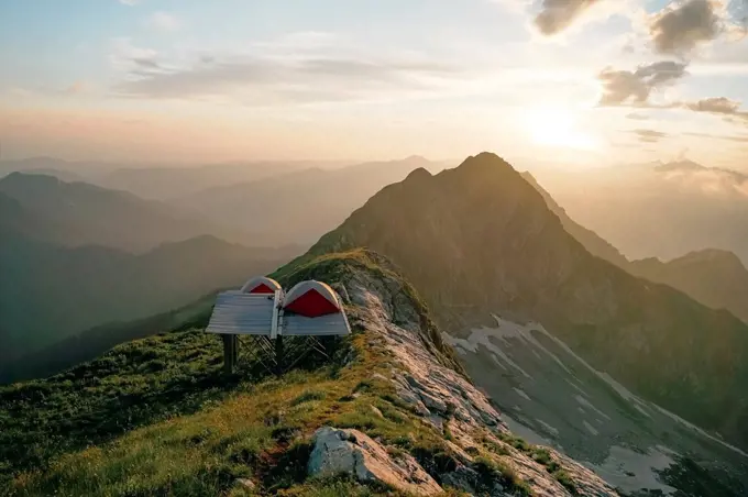 Tent on mountain landscape at sunset in Caucasus Nature Reserve, Sochi, Russia