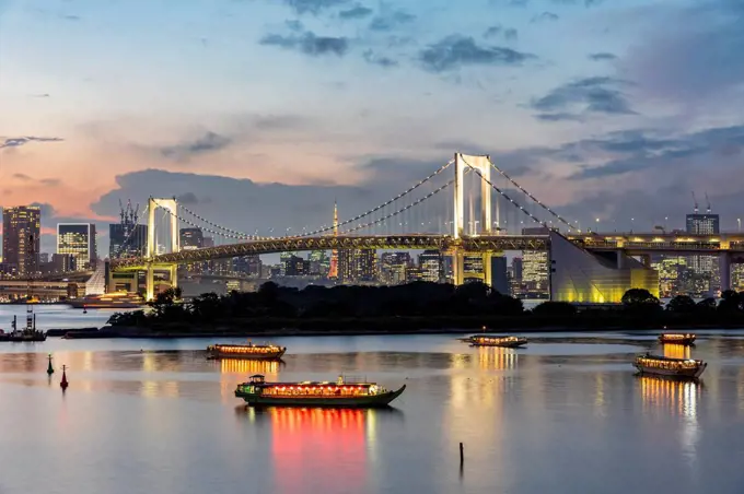 Japan, Kanto Region, Tokyo, Long exposure of Tokyo Bay and Rainbow Bridge at dusk