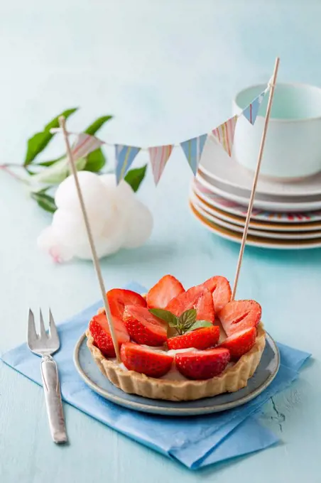 Plate of raspberry tart with vanilla cream