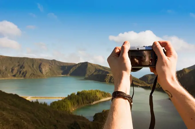 Portugal, Azores,Sao Miguel, Tourist capturing view
