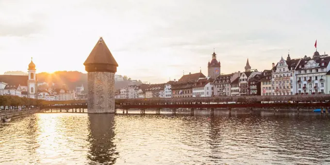 Switzerland, Canton of Lucerne, Lucerne, Old town, Reuss river, Chapel bridge and water tower at sunset