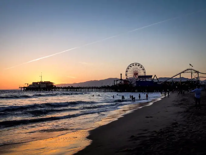 USA, Los Angeles, view to Santa Monica pier and Pacific Park at sunset
