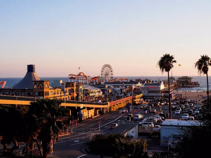 USA, Los Angeles, Santa Monica Beach Pier and Pacific Park at sunset