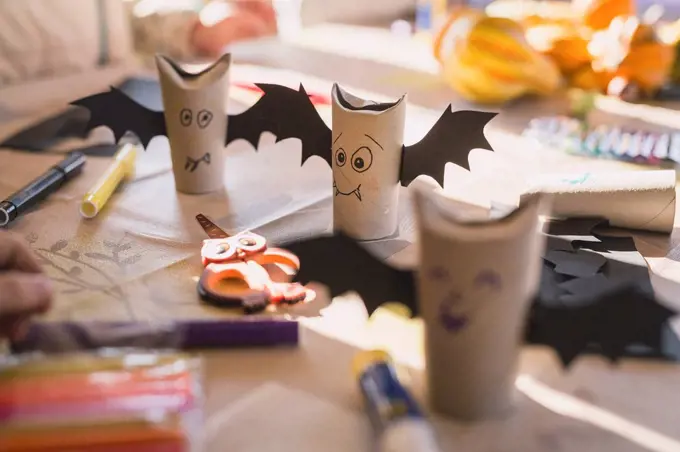 Tinkered paper bats on desk