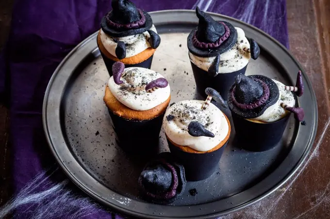 Halloween cupcakes with crashed witches topping