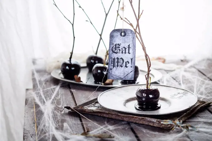 Black candied apples with Halloween decoration